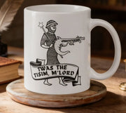 A white mug with a black and white illustration of a knight holding a sword and shield, along with the text "TWAS THE TISIM, M'LORD" printed on it.